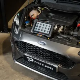 Diagnostic tablet connected to a Ford Fiesta engine during a Stage 1 remap in the workshop.